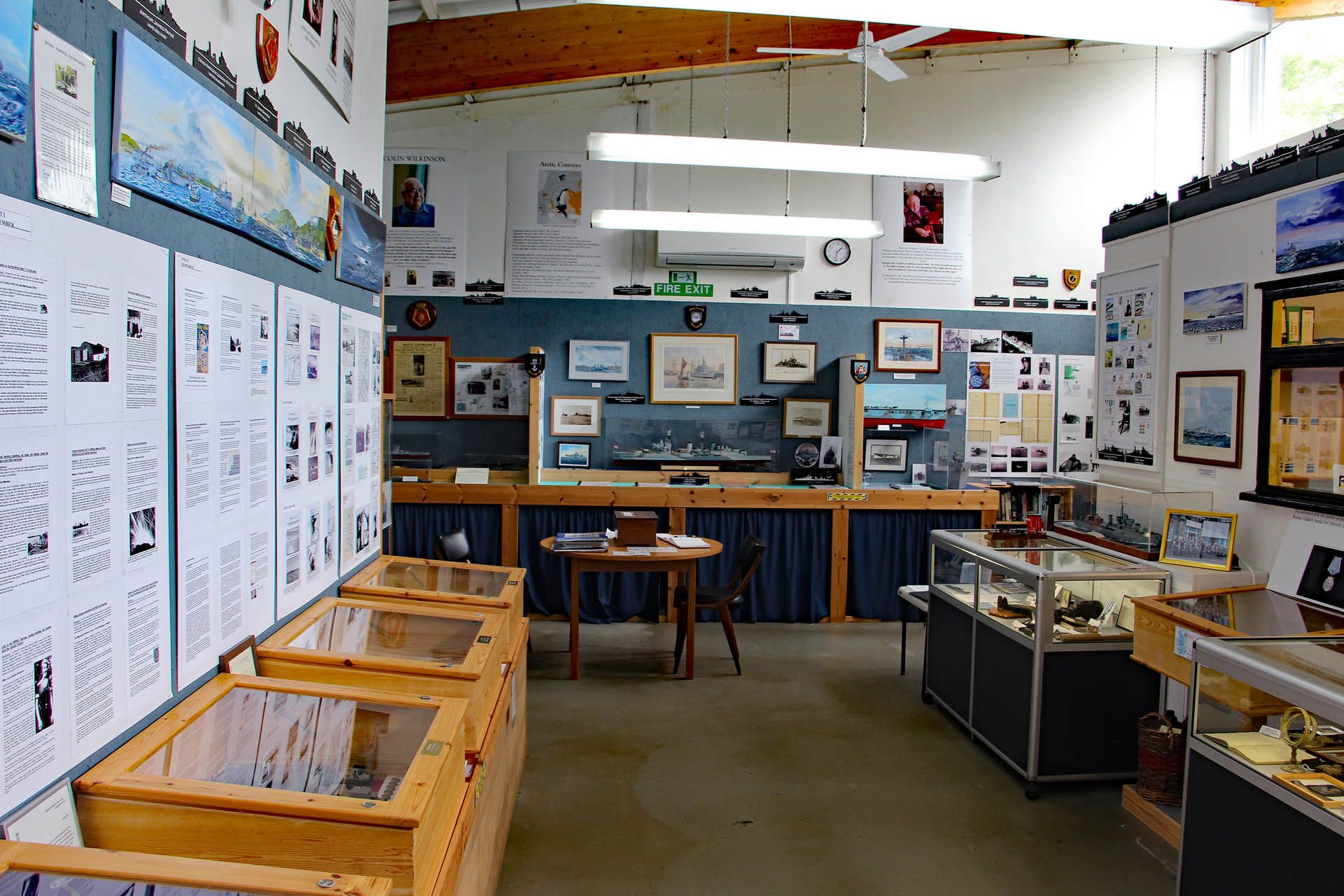 A picture of an exhibition within the Arctic Convoy Museum Aultbea, Gairloch. The picture features artifacts and pictures relating to wartime events.