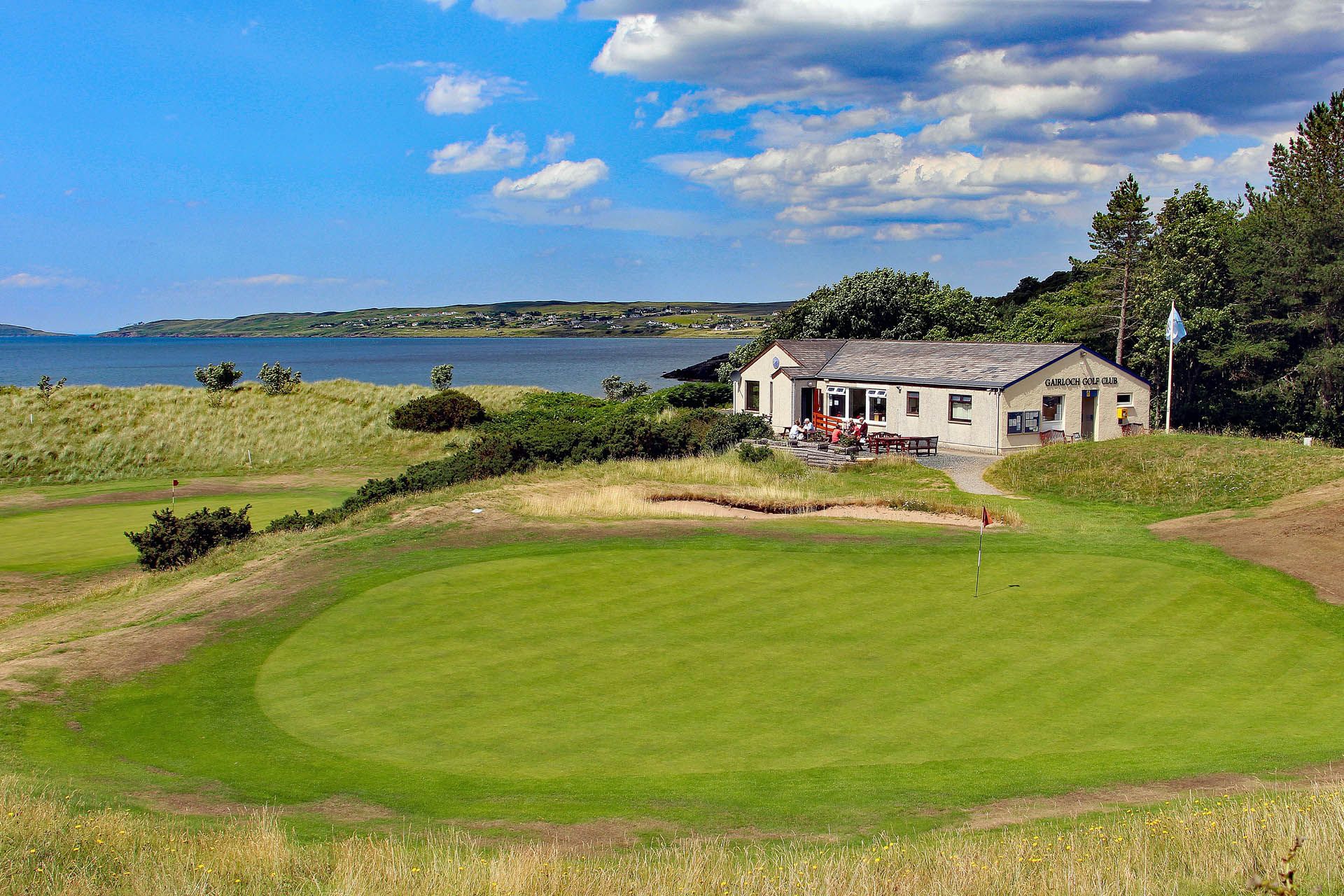 A picture from the putting ground looking at the Gairloch Golf Course Club and Links Cafe-Bar